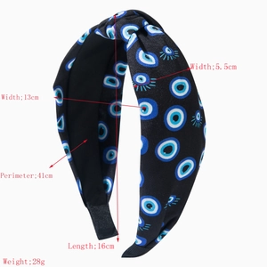 Evil eye print fabric knot headband for women featuring exotic blue and white pattern design