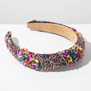 Detail of bohemian thick headband with colorful stones, beads and crystal rhinestones