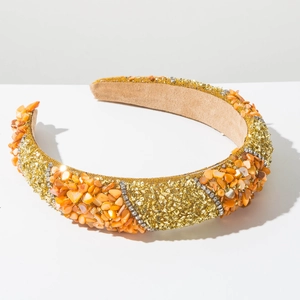 Detail of wide headband featuring amber shell fragments, gold beads and rhinestone trim