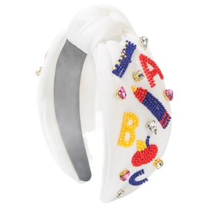 Handmade beaded headband with rhinestone letters and school motifs on white fabric