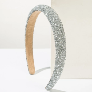 Close-up detail of silver rhinestone sponge headband showing shimmering crystal texture