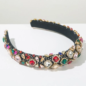 Detailed close-up of Baroque headband with colorful crystals and gold claw settings