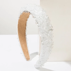 Baroque wide sponge headband with crystal beads on a minimalist white display