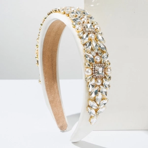 Detail view of white satin headband with luxury baroque crystal rhinestones and pearls