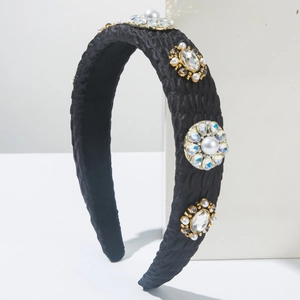 Elegant thick black satin headband with decorative pearls and rhinestones on stone base