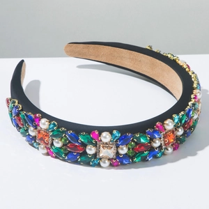 Macro shot of Baroque luxury velvet headband with colorful crystals and white pearls
