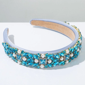 Detailed shot of Baroque light blue satin headband with rhinestones and white pearls