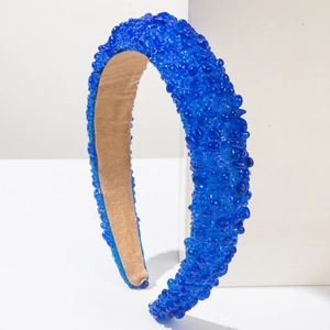 Detail of royal blue beaded wide headband with non-slip faux suede lining texture