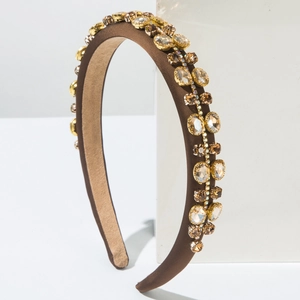 Detail of coffee satin headband featuring double rows of champagne rhinestones