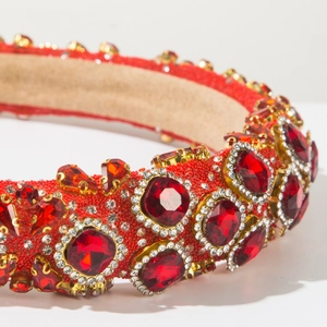Macro shot of luxury red baroque headband with shimmering rhinestones and beads