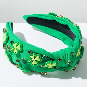 Détail d'un serre-tête vert à nœud pour la Saint-Patrick avec strass et motifs trèfles