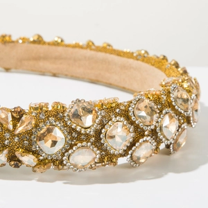 Detail shot of golden baroque headband with champagne crystals and fine beadwork