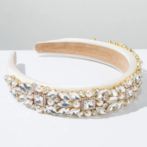 Macro detail of luxury velvet headband with marquise rhinestones and white pearls