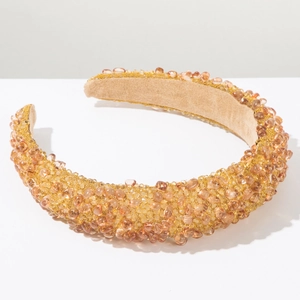 Detail of luxury baroque padded headband with sparkling amber crystals and beads