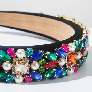 Detailed close-up of Baroque velvet headband with colorful rhinestones and pearls
