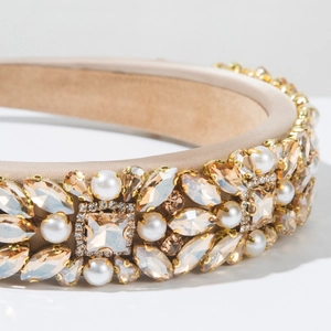 Detail of luxury champagne headband with marquise crystals, zircon stones and pearls