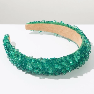 Detail of emerald green sponge headband with hand-sewn crystals and beaded texture