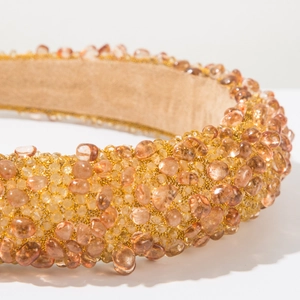 Detailed close-up of Baroque padded headband with amber beads and gold crystals