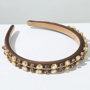 Detail shot of brown satin headband with double-row amber and clear rhinestones