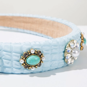 Close-up of light blue bubble textured headband with pearls, turquoise stone and rhinestones