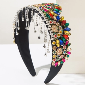 Detailed macro view of baroque headband featuring colorful crystals and silver chain tassels
