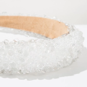 Detailed macro view of crystal bead textures on the padded baroque luxury headband