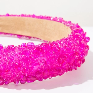 Detailed close-up of pink crystal beads and soft fabric texture on Baroque headband