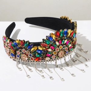 Detail of baroque velvet headband with colorful rhinestones and silver metal tassels