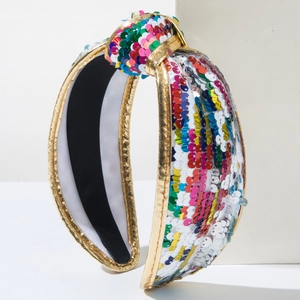Detailed shot of multi-color sequin knotted headband with elegant gold fabric trim