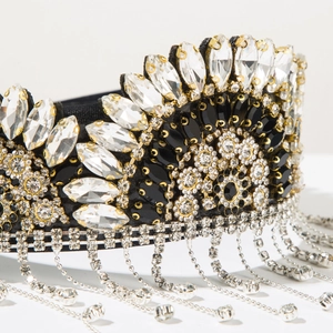 Macro detail of Baroque headband with sparkling rhinestones and long silver tassels