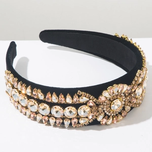 Macro shot of heavy-duty velvet headband with champagne and pink rhinestones detail