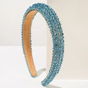 Sparkling aqua blue rhinestone padded headband with crystal embellishment and velvet lining