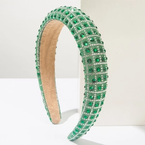Detail of emerald green padded headband with hand-set rhinestones and silver beads