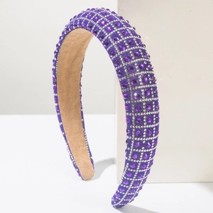 Detail of luxury purple rhinestone headband with thick padding and khaki suede lining