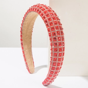 Detailed side view of luxury red rhinestone headband with silver beaded lattice pattern