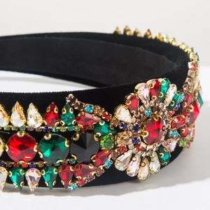 Macro detail of Baroque headband with colorful rhinestones on black velvet fabric