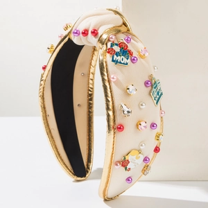 Detail of knotted MOM headband with pearls, crystals, and Mother's Day enamel charms