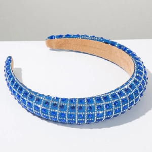 Close-up of luxury padded headband with royal blue rhinestones and silver crystal grid