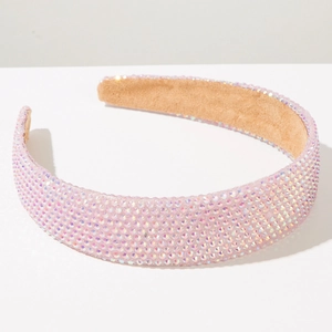 Détail d'un serre-tête rose rembourré avec strass AB et doublure en daim antidérapante