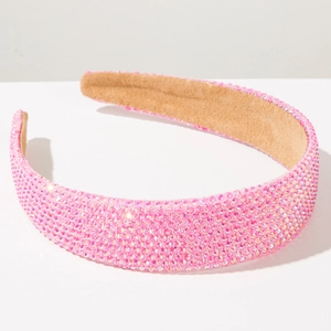 Détails de strass roses scintillants sur un serre-tête large avec doublure en velours