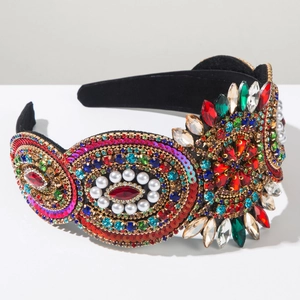 Close-up of Baroque headband featuring intricate hand-sewn crystals and colorful gems