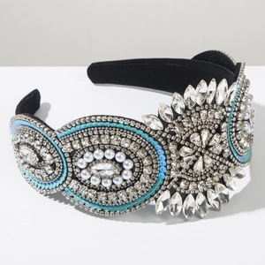 Detailed close-up of Baroque velvet headband with marquise rhinestones and pearls