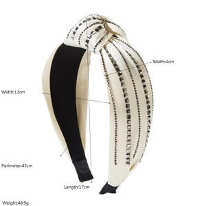 Detailed cream knotted headband with four rows of square rhinestones and product dimensions