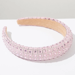Close-up of luxury pink rhinestone headband with sparkling beads and velvet lining