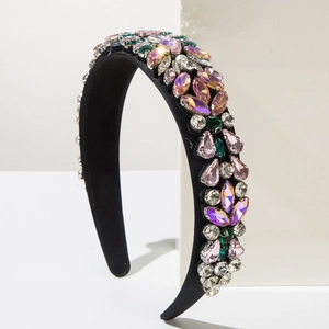 Detailed macro of Baroque fabric headband with colorful hand-set rhinestones and crystals