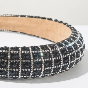 Macro detail of luxury wide headband with sparkling black rhinestones and soft lining