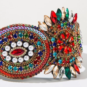 Close-up of Baroque headband with intricate colorful rhinestones and faux pearls