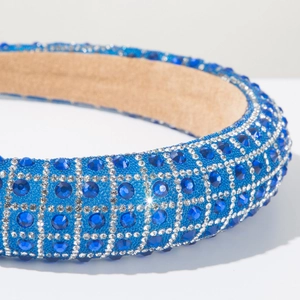 Detail shot of luxury blue rhinestone headband with sparkling square crystal patterns