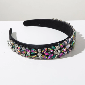Close-up of luxury velvet headband with colorful marquise rhinestones and white pearls