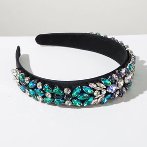 Detailed close-up of velvet headband with colorful rhinestones and imitation pearls